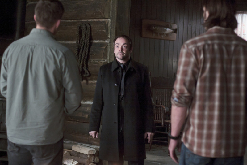 Dean and Sam Winchester talk to Crowley