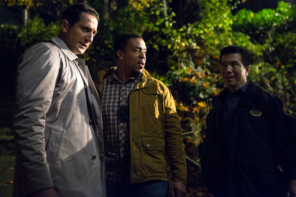 GRIMM -- "Into The Schwarzwald" Episode 512 -- Pictured: (l-r) Sasha Roiz as Captain Renard, Russell Hornsby as Hank Griffin, Reggie Lee as Sergeant Wu -- (Photo by: Scott Green/NBC)