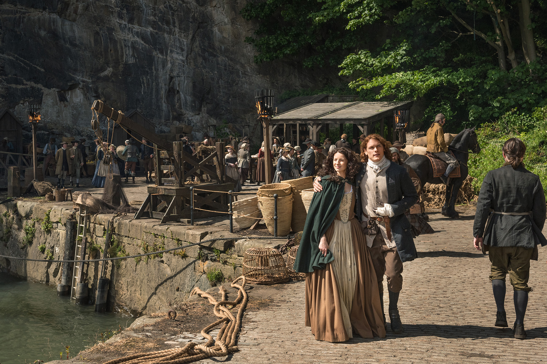 Claire and Jamie taking a stroll, plotting the dismantling of a rebellion. You know, normal things. (Courtesy Starz)
