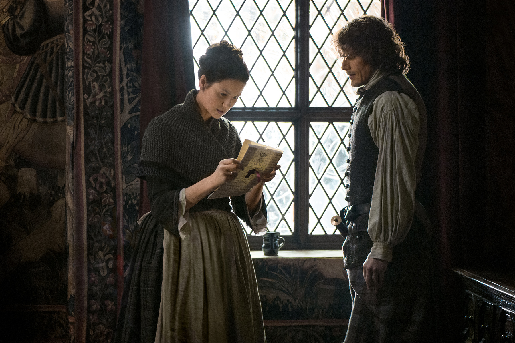 Jamie and Claire look over the letter that names Jamie a Jacobite supporter. Why can't this show just be about planting potatoes? I would be okay with that. 