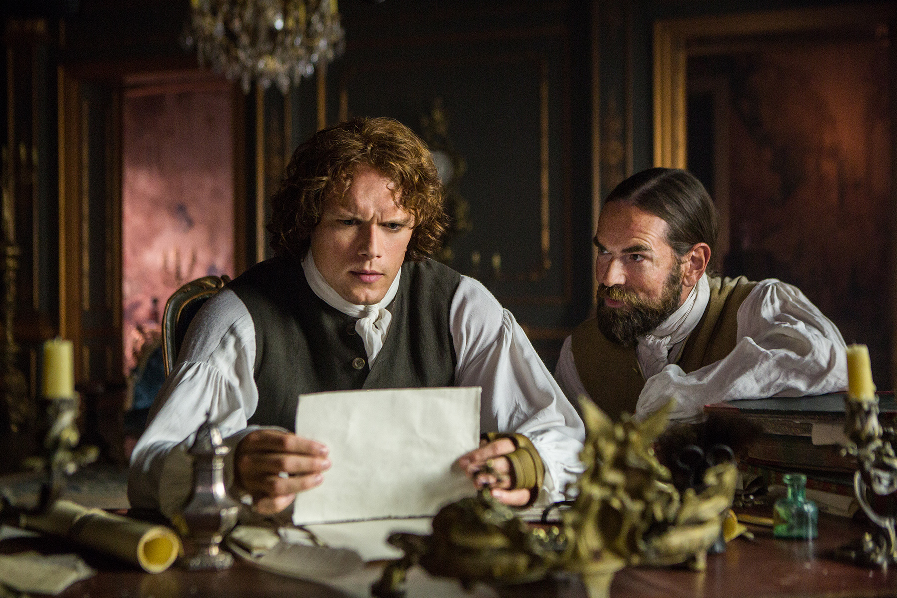There's very little a good punch can't resolve between these two. (Left, Sam Heughan as Jamie Fraser. Right, Duncan Lacroix as Murtagh Fitzgibbons