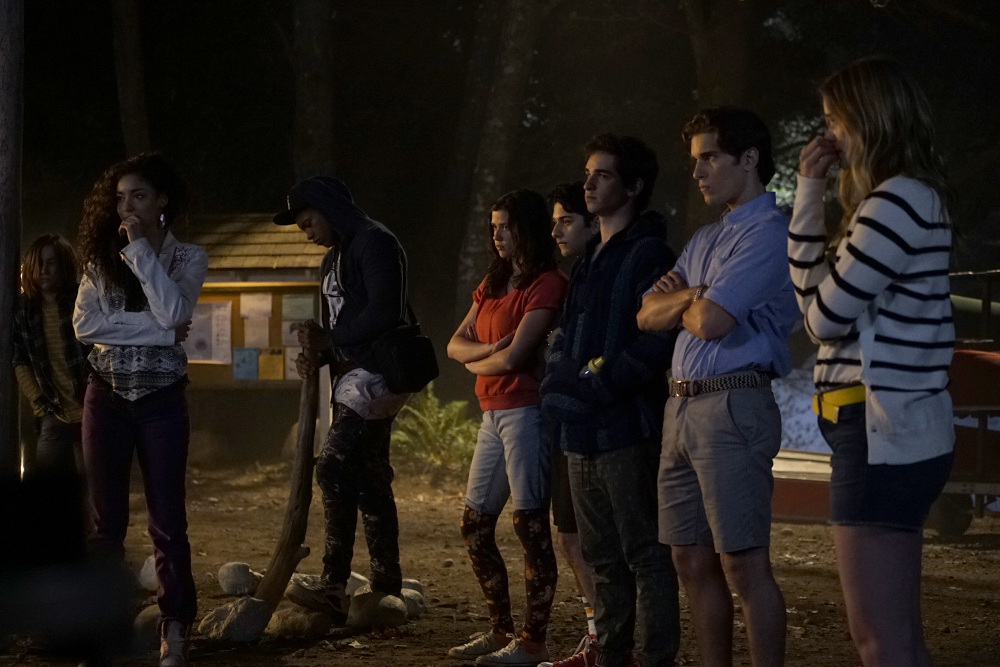A pack of teens hanging around haunted woods at night. What could go wrong? From left: Paulina Singer as Jessie, Eli Goree as Joel, Amber Coney as Cricket, Mark Indelicato as Blair, Zachary Gordon as Blotter, Ronen Rubenstein as Alex, and Elizabeth Lail as Amy. (Courtesy Freeform/Katie Yu)
