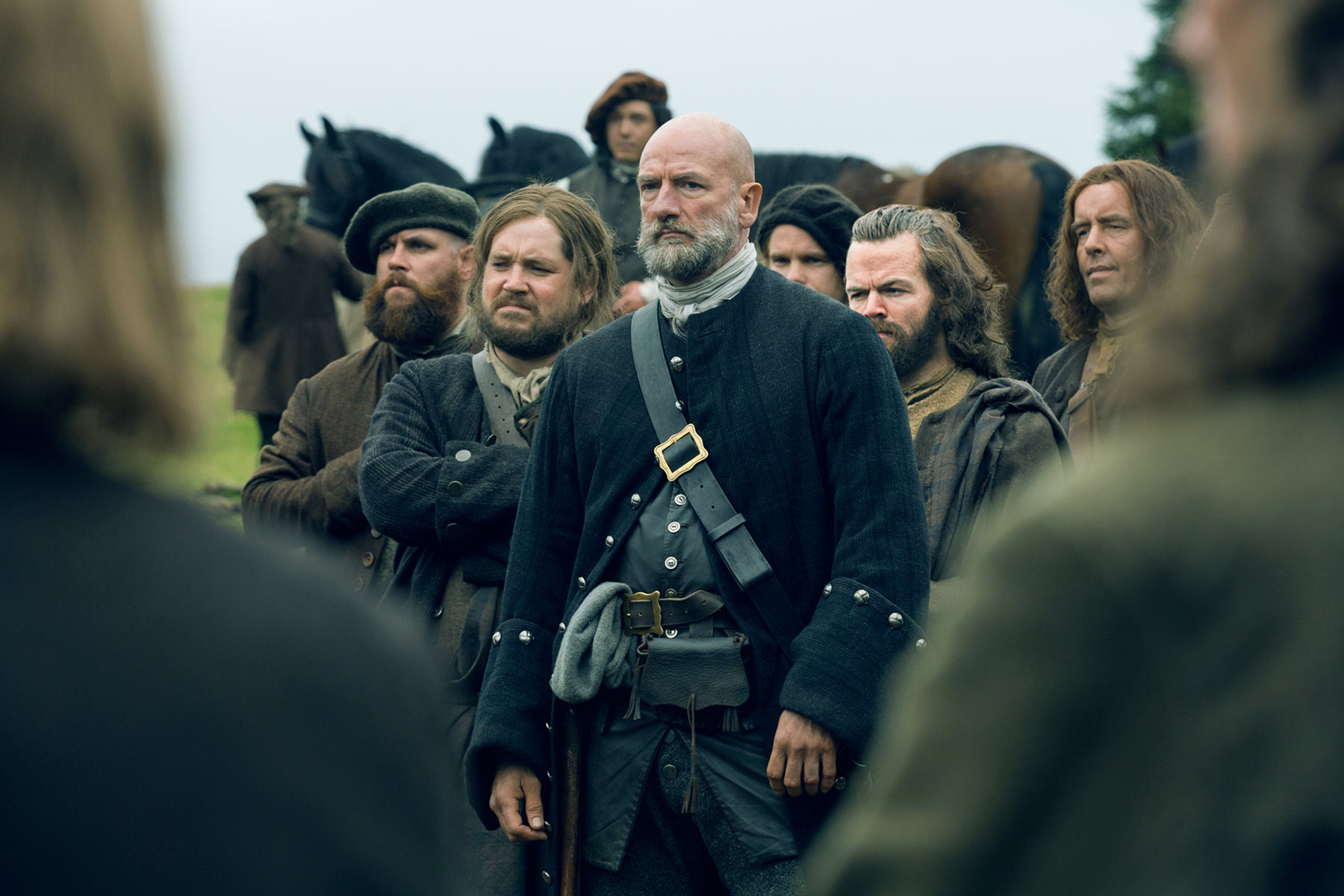 Above center: A man who does not like being told that he doesn't fight correctly. (Left, Grant O'Rourke as Rubert MacKenzie. Center, Graham McTavish as Dougal MacKenzie. Right, Stephen Walters as Angus Mhor.)