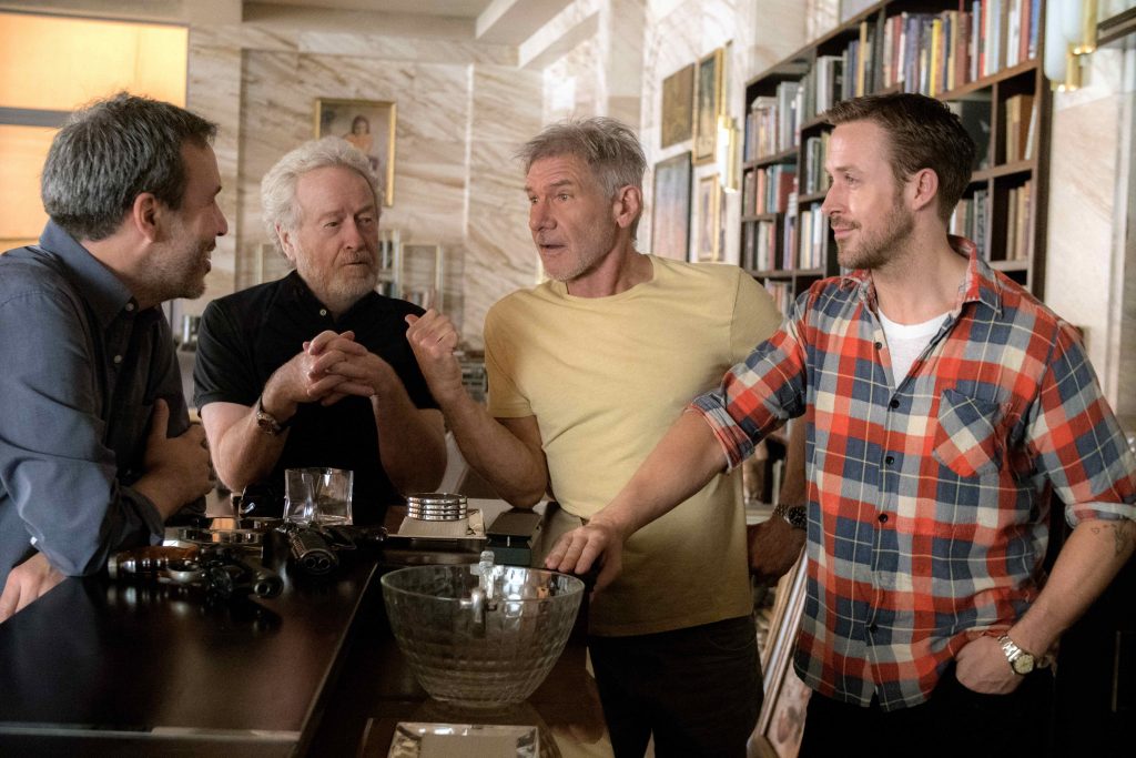 (L-r) Director Denis Villeneuve, Ridley Scott, Harrison Ford and Ryan Gosling on the set of Alcon Entertainment’s “BLADE RUNNER 2049,” a Warner Bros. Pictures Release. Photo by: Stephen Vaughan