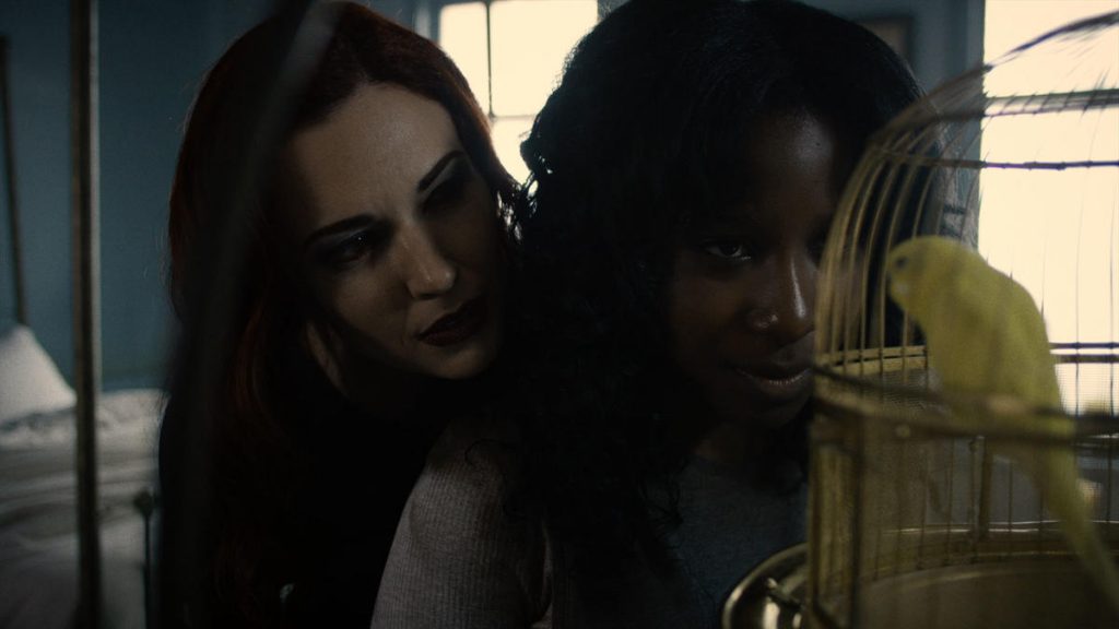 Rebecca (Laura Mennell) promises a better life for Sheema (Naika Toussaint)...at a price.