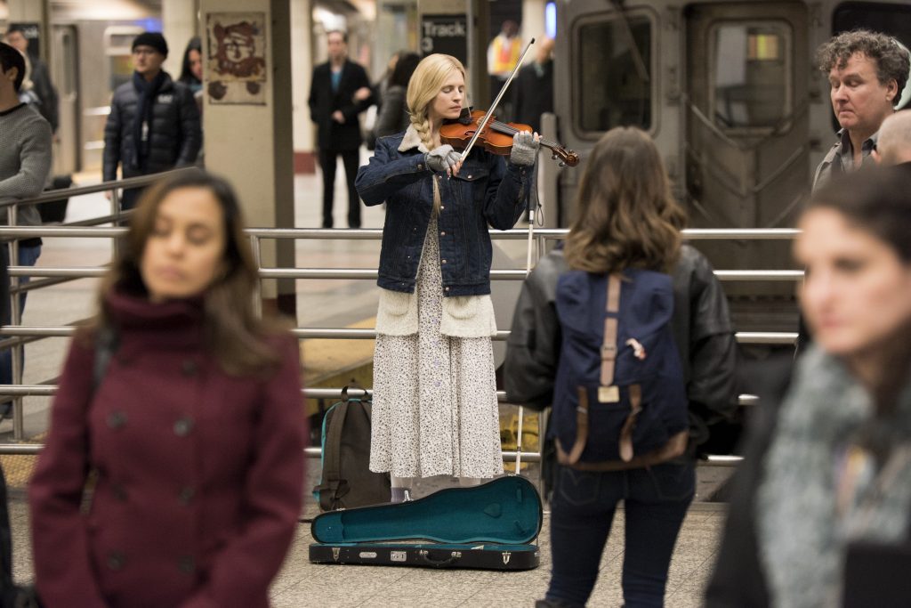 Prairie playing the violin in New York (Myles Aronowitz/Netflix)
