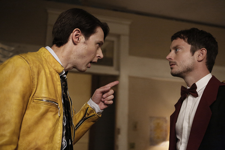 Dirk explains things to Todd (Elijah Wood).